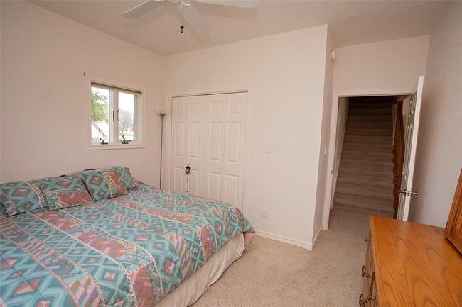 Full bathroom featuring vanity, toilet, tile floors, and shower / tub combo with curtain | Image 32