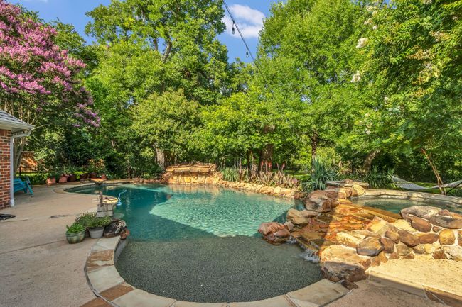 Swimming pool with a patio | Image 28