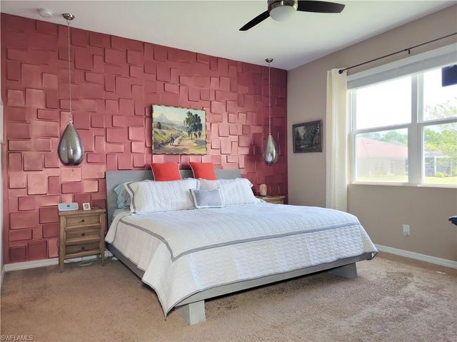 Carpeted bedroom featuring ceiling fan and baseboards | Image 26