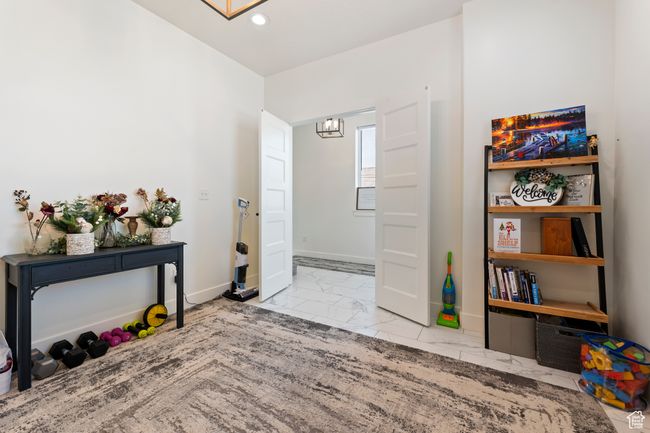 Foyer with recessed lighting, marble finish floor, baseboards, and an inviting chandelier | Image 9