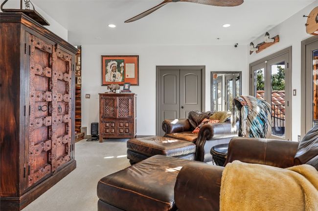 Living area with recessed lighting, a ceiling fan, french doors, and light carpet | Image 14