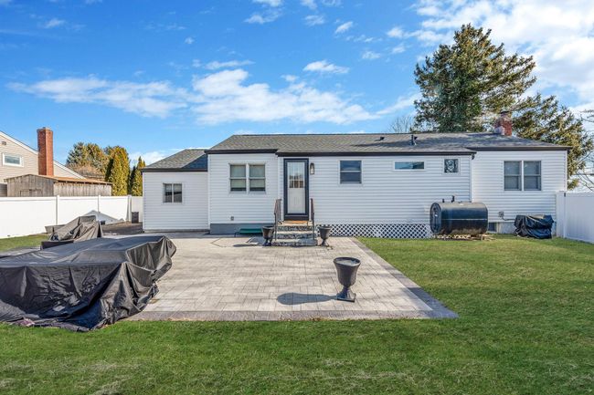 Back of property featuring a lawn and a patio area | Image 23