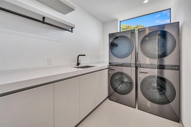 Custom Laundry with Pedini Italian Cabinetry, Blanco Sink, and Double Washer and Dryer setup | Image 30