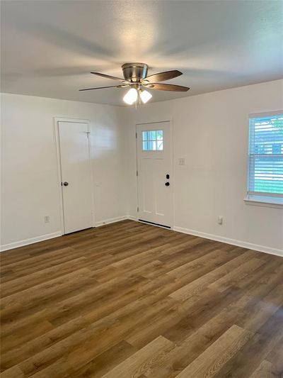 Entryway with ceiling fan and dark hardwood / wood-style flooring | Image 3