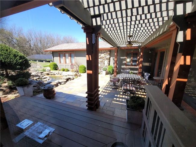 Deck with a pergola, outdoor dining area, and a patio | Image 60