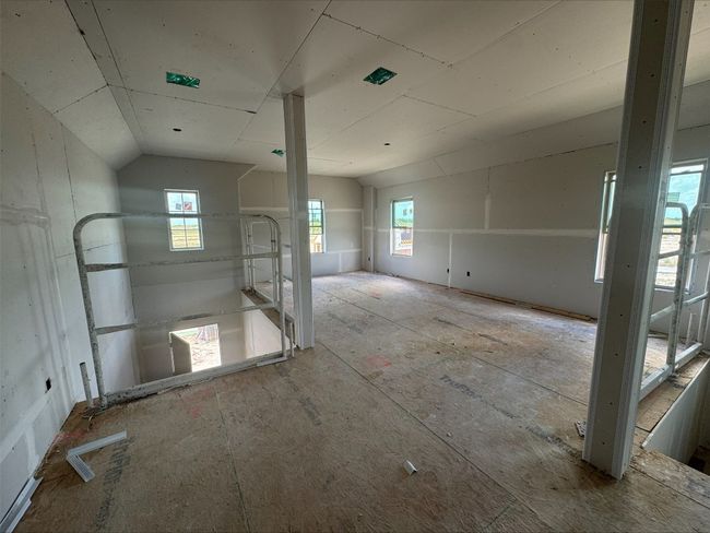 Unfurnished room with plenty of natural light and vaulted ceiling | Image 5