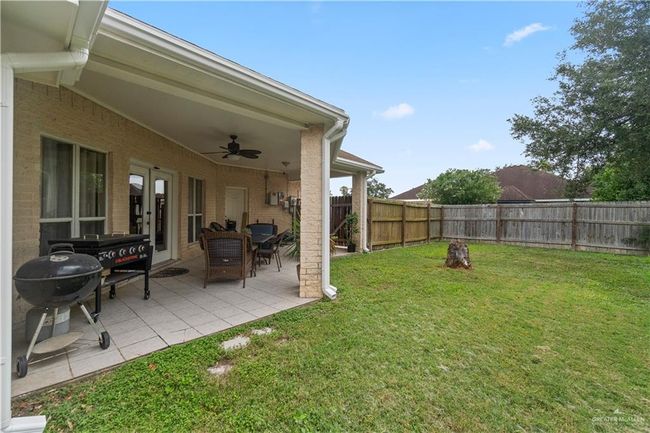 View of yard with ceiling fan and a patio | Image 20