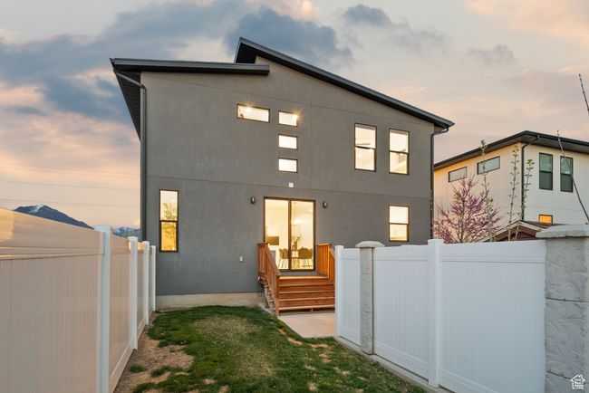 Rear view of property featuring fence private yard and stucco siding | Image 42