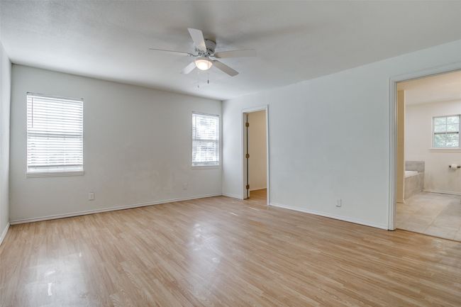 Spare room featuring ceiling fan and light wood-style floors | Image 18