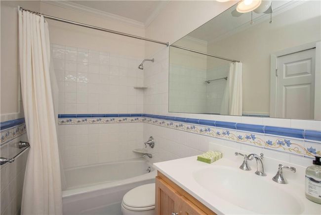 The Full tiled Bathroom has been updated & offers a Linen Closet inside. | Image 20