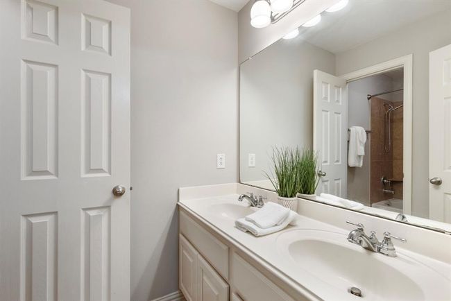 Second floor bathroom with double sinks and combination tub/shower. | Image 29