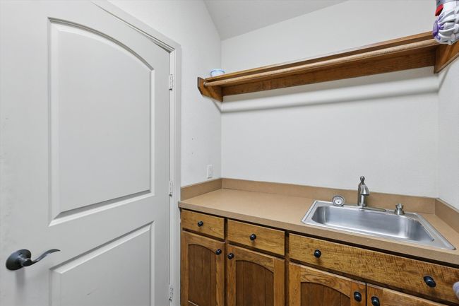 Laundry area with a sink | Image 21