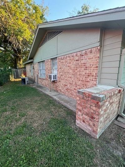 View of side of property featuring central AC and a lawn | Image 3