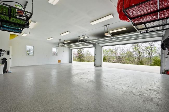 Expansive garage with epoxy floors. | Image 50