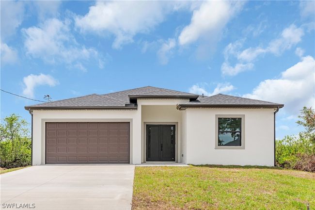 Prairie-style home with a front yard and a garage | Image 12