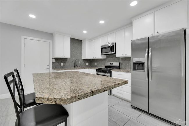 other view of kitchen with SS appliances | Image 5