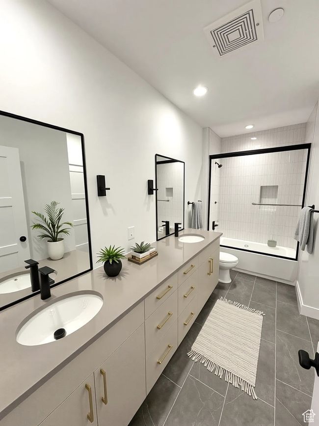Bathroom with double vanity, shower / bath combination with glass door, and recessed lighting | Image 7
