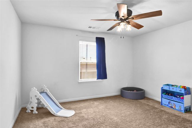Game room featuring ceiling fan, baseboards, carpet, and visible vents | Image 21