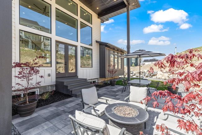View of patio / terrace featuring outdoor dining area, french doors, and an outdoor fire pit | Image 72