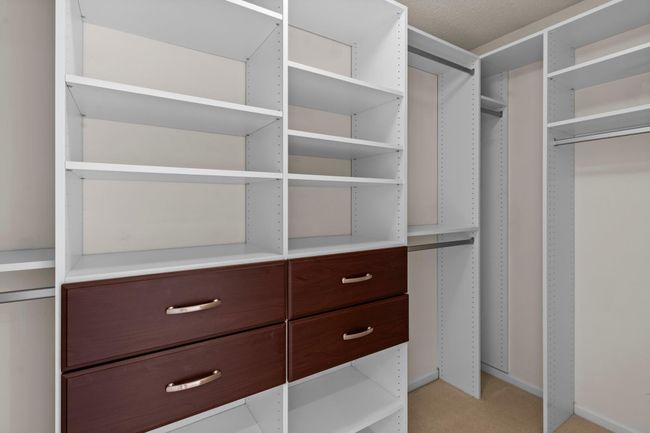 You have plenty of space in the custom walk in closet | Image 24
