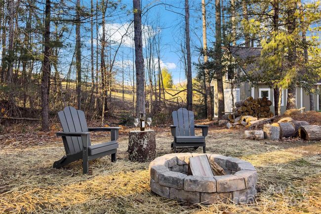 Fire pit in the .64 acre lot. | Image 36
