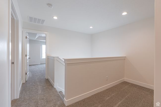 Hall with carpet and recessed lighting | Image 10