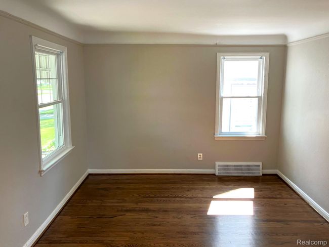 View from kitchen into living room. Fresh paint & refinished oak flooring. | Image 6
