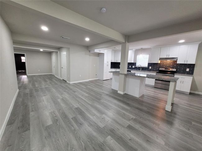 Living, kitchen, dining and looking towards the Flex room or game room. | Image 4