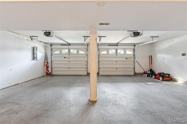 Garage featuring a garage door opener | Image 27