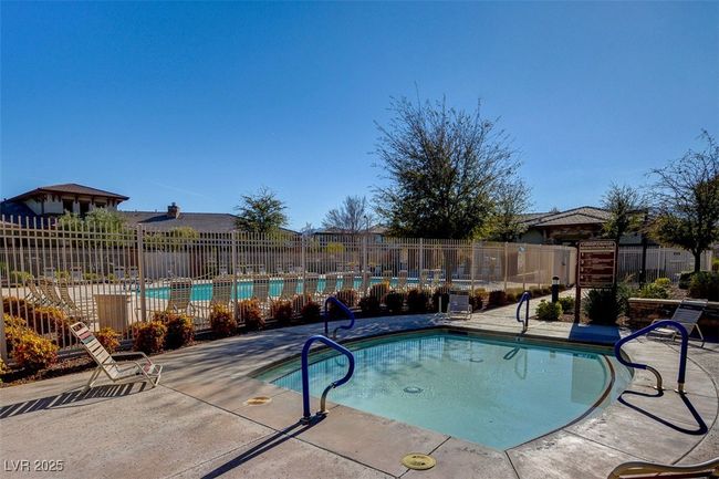 Community pool with a patio | Image 76