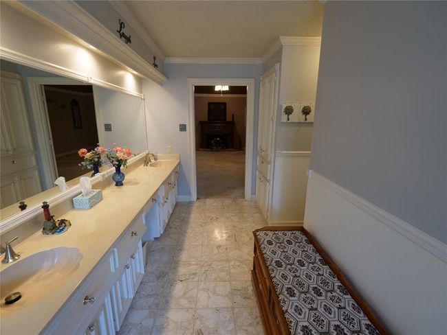 Primary bathroom with primary bedroom and fireplace in view | Image 37