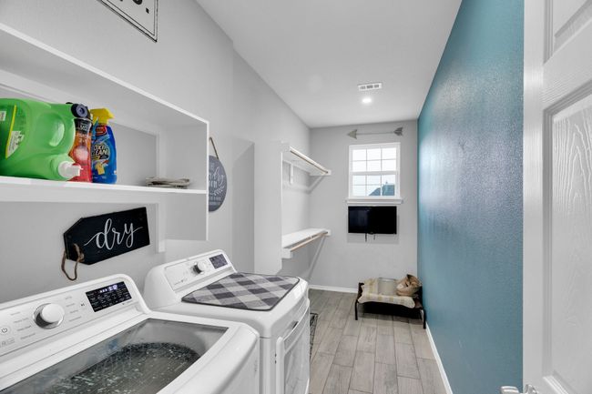 Laundry area with washer and dryer, baseboards, light wood-type flooring, and recessed lighting | Image 13