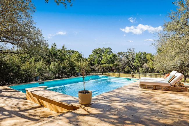View of pool with a fenced in pool, a patio, and fence | Image 35