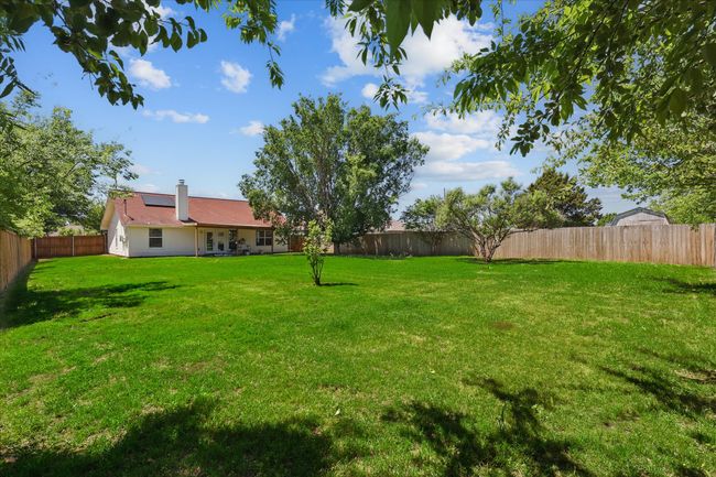View of yard with a fenced backyard | Image 33