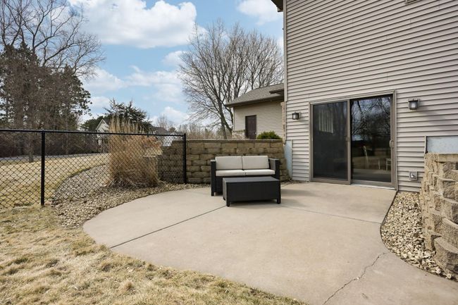 Patio space off the basement walk-out. Could be a nice spot for more outdoor furniture? Maybe a hot tub? | Image 33