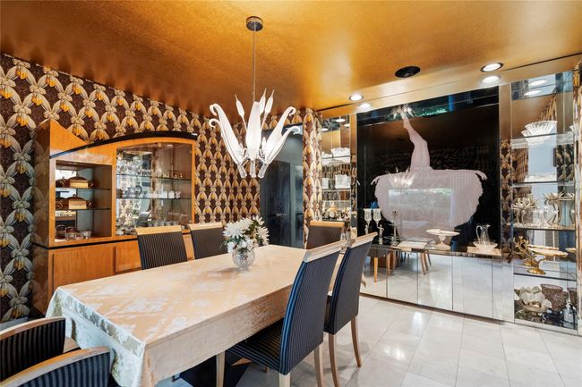 Wine cellar with a chandelier, recessed lighting, and tile patterned flooring | Image 5