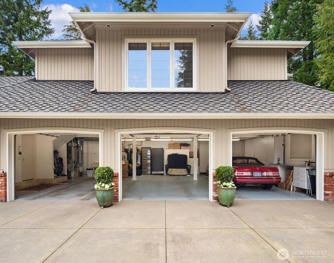 Large 3 car garage with extra coverage in back barn. | Image 35