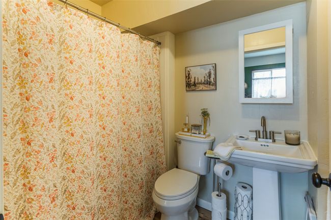 Full bathroom with a sink and toilet | Image 19