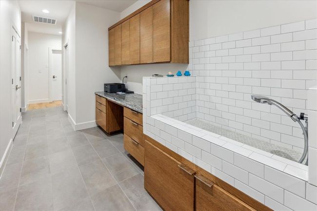 Pet shower in laundry room. | Image 12