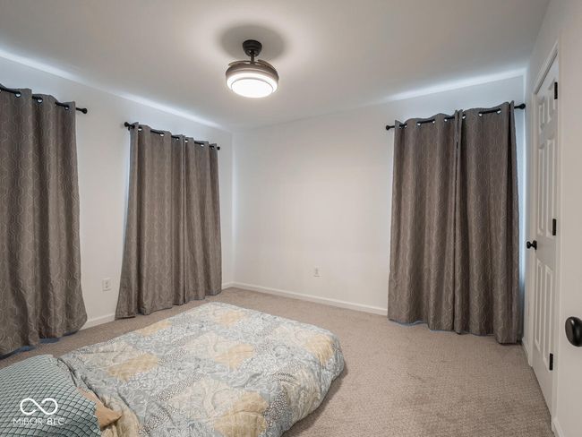 bedroom with baseboards and carpet floors | Image 42