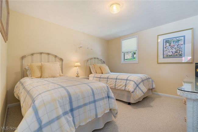 Carpeted bedroom featuring baseboards | Image 12