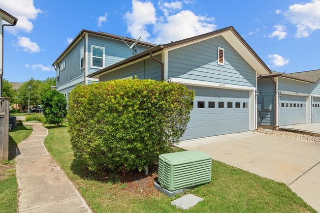 The spacious 2-car garage, with epoxy flooring, offers ample storage and parking space, keeping your vehicles protected while providing room for all your gear and seasonal items | Image 36