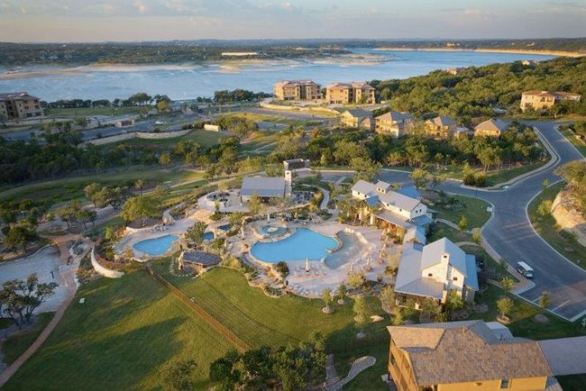 Aerial overview of property's location featuring a pool and a nearby body of water | Image 21