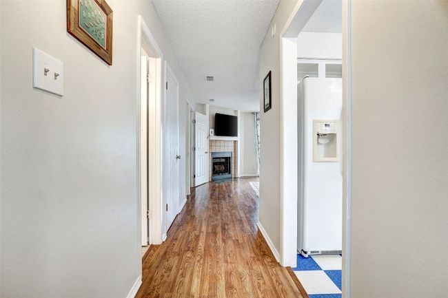 Corridor with baseboards and wood finished floors | Image 5