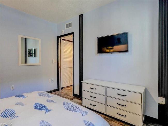 GUEST BEDROOM. LOUVERED DOORS HIDE WASHER/DRYER | Image 29