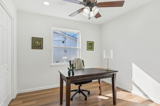 Office area with baseboards, wood finished floors, a ceiling fan, and recessed lighting | Image 15