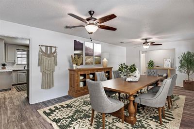 Dining area featuring ceiling fan, dark hardwood / wood-style flooring, and a textured ceiling *virtually staged* | Image 3