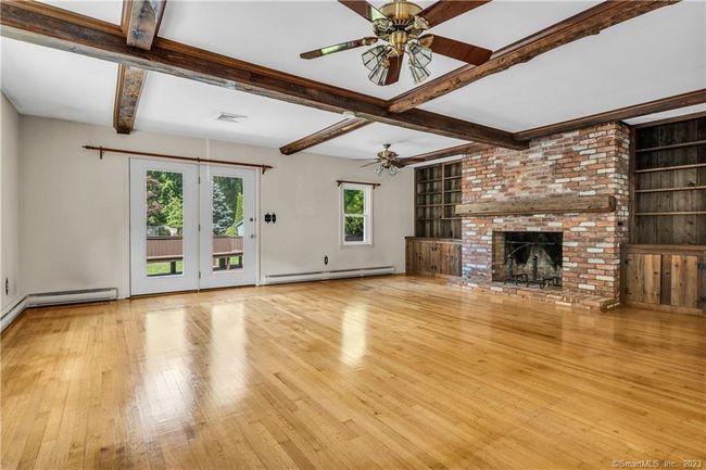 The very large Family Room has a vaulted ceiling, and access to the deck and back yard. | Image 4