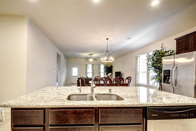 The great line of sight from the kitchen all the way through to the family room makes it easy to spend time with your family. | Image 10