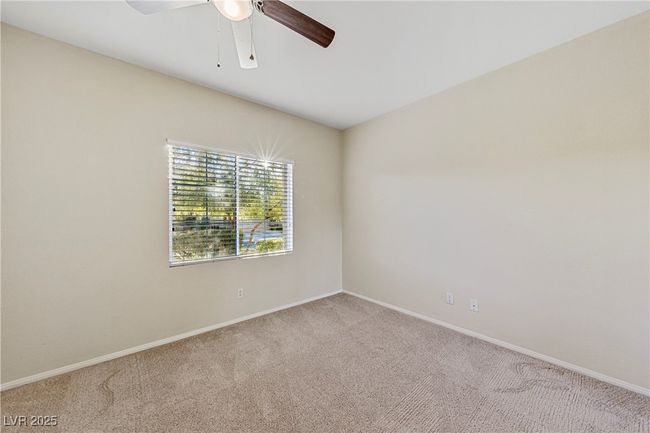 Empty room with carpet and a ceiling fan | Image 14